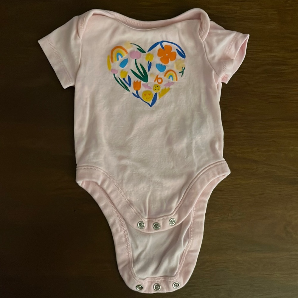 Light pink onesie with heart design